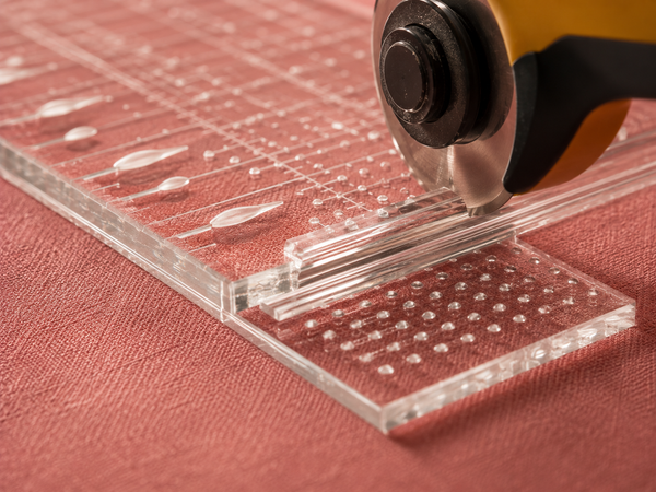 Two problems. Two solutions. Grip dots hold the ruler. The channel holds the blade.